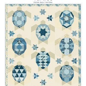 May include: A pieced quilt pattern featuring six turtle designs in shades of blue and cream. The turtles are surrounded by star shapes. The quilt size is 64.5 inches by 73.5 inches.