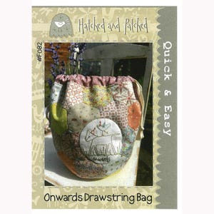 May include: A sewing pattern for a drawstring bag with a patchwork design and an embroidered image of a sheep and a bird. The pattern is titled "Onwards Drawstring Bag" and is from the "Hatched and Patched" collection. The pattern number is #F082.