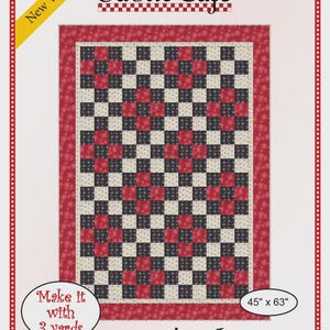 May include: A Fabric Cafe Nine Patch quilt pattern. The quilt features a checkerboard design in red, black, and cream colors. The quilt measures 45 inches by 63 inches. The text "Make it with 3 yards" is also included.