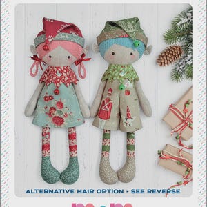 May include: Two fabric Christmas elf dolls titled SANTA'S HELPERS. The left doll has pink hair, a red floral hat, and a teal floral dress. The right doll has blue hair, a green patterned hat, and a tan outfit with nutcracker prints.