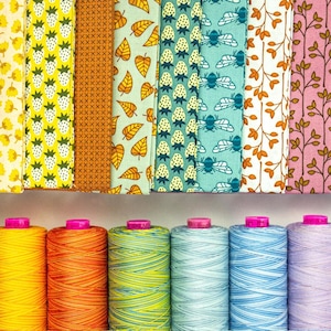 May include: A collection of ten spools of colorful thread, each with a different pattern. The thread is wound around the spools and is ready for use in sewing or embroidery projects.