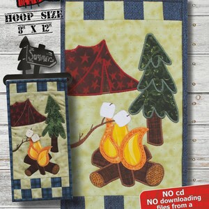 May include: A fabric panel with a camping theme, featuring a campfire, tent, and trees. The panel is approximately 6.5 x 12.25 inches. The design includes the text "CAMPFIRE GOODIES" and "SUMMER".
