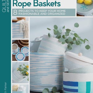 May include: A book cover titled "Learn to Make Rope Baskets" with images of handmade rope baskets in various sizes and designs. The baskets are white with blue accents, and some have lids. The book is by Elizabeth Parker and is part of the Quilt and Sew series.