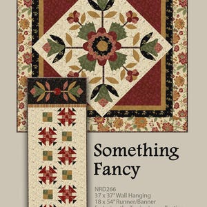 May include: A quilted wall hanging and runner featuring floral and geometric patterns in red, cream, black, and green. The wall hanging measures 37 x 37 inches, and the runner is 18 x 54 inches. The text "Something Fancy" is displayed.