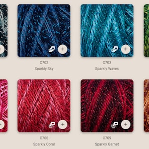 May include: A collection of fabric swatches in various colors, including blue, green, pink, and gold. Each swatch is labeled with a code and a descriptive name, such as "Sparkly Constellation" and "Sparkly Lavender." The "RUSTY ROOF FABRICS" logo is visible.