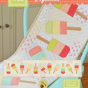 May include: A fabric panel featuring colorful popsicle designs in shades of red, pink, green, and yellow. The panel includes the text "Mini Popsicles" and "Fig Tree & Co."