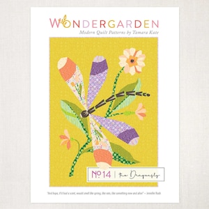 May include: A colorful print featuring a dragonfly design with orange, purple, and green accents. The print is set against a yellow background and includes the text "WONDER GARDEN" and "No. 14 the Dragonfly".