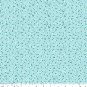 May include: A light blue fabric with a repeating pattern of teal paw prints and bone shapes.