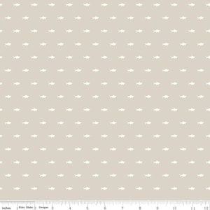 May include: A beige fabric with a repeating pattern of white shark silhouettes. The fabric is measured in inches.