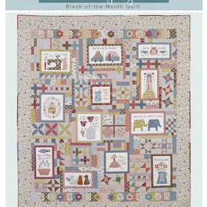 May include: A patchwork quilt titled "A Letter to My Daughter." The quilt features various framed images with whimsical illustrations, including animals, houses, and floral designs. The color palette includes soft blues, pinks, and creams.