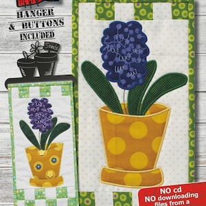 May include: A machine embroidery pattern featuring a Giant Hyacinth design. The finished size is 6.5 x 12.25 inches. The design includes a purple flower in a yellow polka-dotted pot with green leaves. The hoop size is 8 x 12 inches.