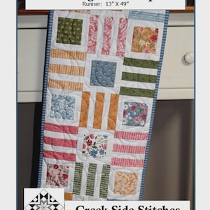 May include: A colorful patchwork runner made of charm squares. The runner is 13 inches by 49 inches and features squares with floral, striped, and solid patterns in various colors. The text "Connecting Charm Squares" and "Creek Side Stitches" are visible.