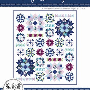 May include: A quilt with a floral and geometric pattern in shades of blue, purple, and white. The quilt is labeled "Seaglass Cottage" and measures 80" x 92". The design includes star and square motifs. The quilt is a twelve-month block-of-the-month project.