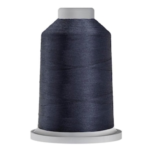 May include: A spool of dark blue thread for sewing or embroidery.