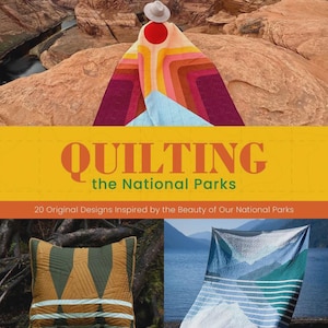 May include: A book cover with the title "QUILTING the National Parks" in orange and yellow. The cover features a person wearing a colorful quilt with a hat, overlooking a canyon. Two quilts and a pillow are also shown.