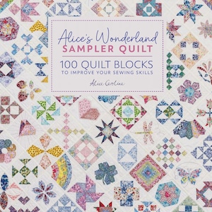 May include: A colorful sampler quilt with various geometric and floral patterns. The quilt features a variety of shapes, including stars, hearts, and flowers, in shades of red, blue, and green. The text "Alice's Wonderland Sampler Quilt" is displayed in a white rectangle.