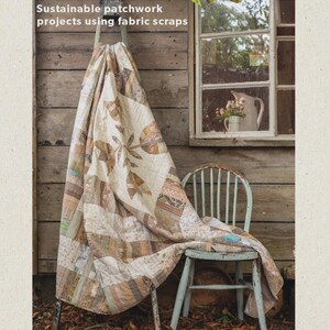 May include: A book cover titled "STRING QUILTS" with the subtitle "Sustainable patchwork projects using fabric scraps." A patchwork quilt is draped over a ladder and a distressed blue chair. The background is a wooden wall and a window.
