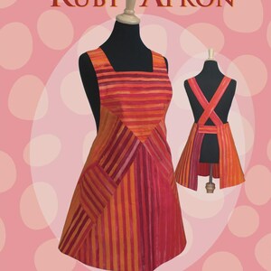 May include: An apron pattern titled "Ruby Apron" by Rebecca Ruth Designs. The apron is displayed on a mannequin, showcasing a design with vertical stripes in shades of orange, red, and pink. The pattern includes three sizes and is easy to make.