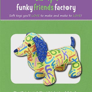 May include: A soft toy dachshund dog with a yellow body covered in colorful letters. The dog has blue ears and a blue tail. The text "funky friends factory" and "Digger & Dixie DACHSHUND" are visible. The toy is 10 inches tall and 14 inches long.