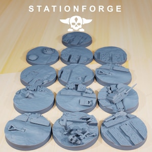 May include: Twelve gray plastic round bases with various textured details, including a skull, bones, and a shovel. The bases are designed for tabletop gaming.