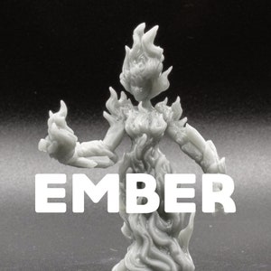 May include: A gray 3D printed figurine of a female figure made of flames. The figure is standing with its arms outstretched and has a flowing, ethereal appearance. The word "EMBER" is printed in white below the figure.