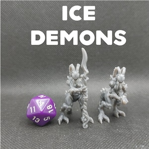 May include: Two gray, detailed, miniature ice demon figures with a purple 20-sided die. The demon on the left holds a spear and has a rabbit-like head. The demon on the right has a ram-like head and is standing on a base.