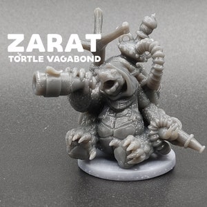May include: A gray 3D printed miniature of a turtle character named "Zarat, Tortle Vagabond". The turtle is wearing a hooded cloak and holding a telescope and a smoking pipe.