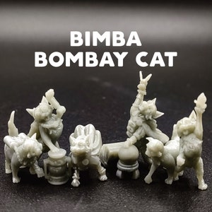 May include: A set of six gray 3D printed figurines of Bombay cats in various poses. The cats are wearing clothes and holding objects, such as a drum and a microphone. The text "BIMBA BOMBAY CAT" is printed above the figurines.