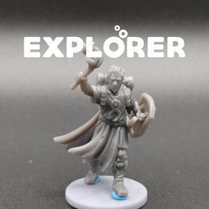 May include: A gray plastic miniature figure of a fantasy explorer holding a torch and a shield. The figure is standing on a gray base with the word "EXPLORER" printed above it.