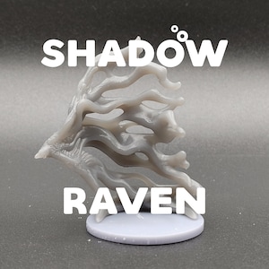 May include: A gray 3D printed miniature of a shadow raven, a mythical creature with a skeletal, bird-like form. The miniature is posed in flight, with its wings spread wide. The miniature is on a round, gray base.
