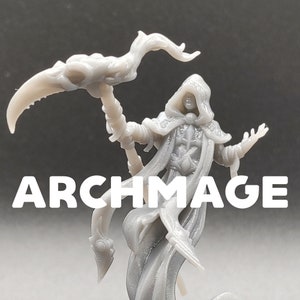 May include: A gray 3D printed miniature of an archmage, wearing a hooded robe and holding a staff with a curved top. The miniature is posed with one hand raised and the other holding the staff. The word "ARCHMAGE" is printed below the miniature.