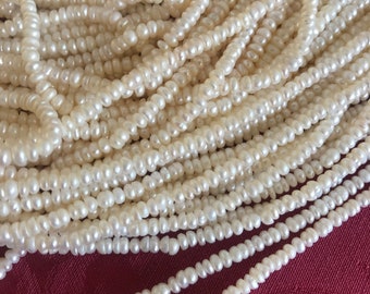 Strand freshwater pearls AA grade rondelle button 3 mm x 2 mm white cultured pearls e453
