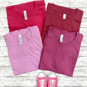 Bella Canvas 3001 Heathered Tshirts in various colors.