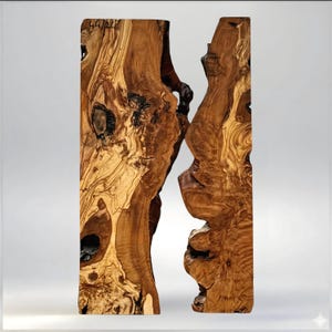 May include: A unique, handcrafted wooden table with a natural, organic design. The table is made from two vertical slabs of wood, showcasing the wood's grain and knots. The color is a warm brown with lighter and darker tones. The table has a modern, rustic aesthetic.