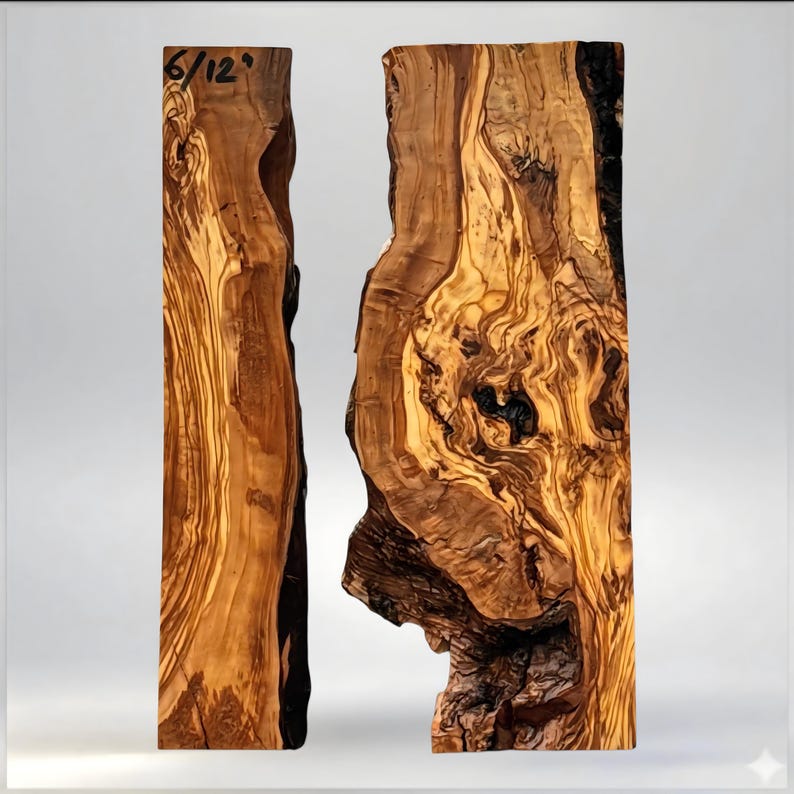 May include: Two pieces of raw, unfinished wood with a natural, organic appearance. The wood grain is visible, with a mix of light and dark brown tones. The text "6/12" is visible on the top left piece. The wood has a rough, textured surface.