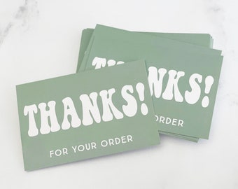 May include: A stack of sage green thank you cards with white text that reads "THANKS! FOR YOUR ORDER".