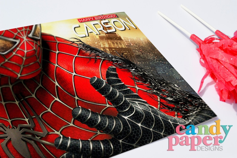 May include: A red and black Spiderman birthday card with the text "Happy Birthday Carson" on the front.
