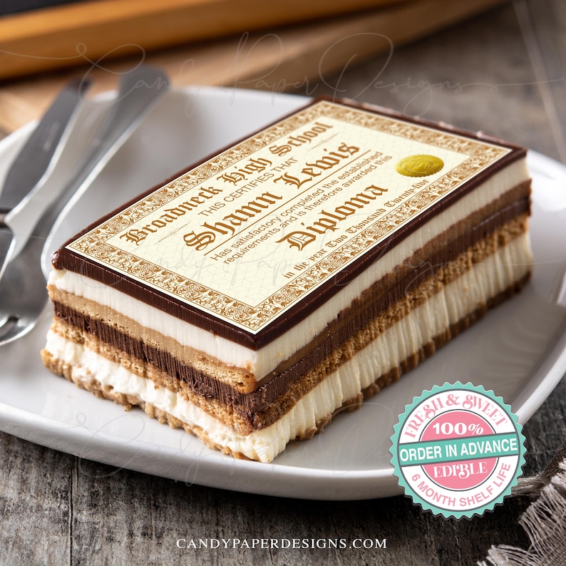 May include: A chocolate cake with a decorative edible image of a graduation diploma. The diploma is decorated with a gold seal and reads "Broadneck High School" and "This certifies that Shamn Lewis has satisfactory completed the established requirements and is therefore awarded this Diploma in the year Two Thousand Twenty- ".