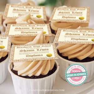 May include: A set of six graduation cupcake toppers featuring a diploma design with the text "Broadneck High School" and "Shamn Lewis Diploma". The toppers are printed on edible paper and are perfect for decorating cupcakes for a graduation party.
