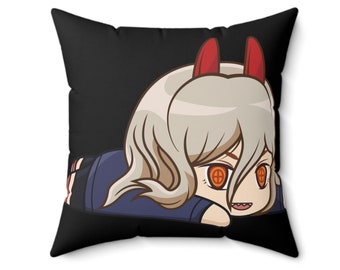 May include: A square cushion with a black backdrop, showcasing a cartoon character with light blonde hair, red horns, and orange eyes. The character is lying down, wearing a blue uniform. A decorative item for the home.