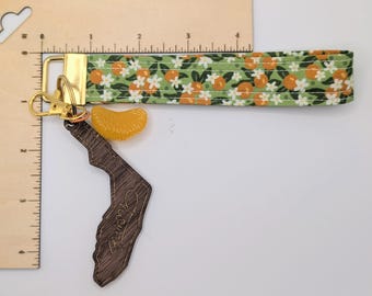 Florida Orange themed wrist key fob with wooden state and orange slice