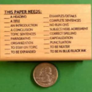 This Paper Needs - Teacher's Writing/Composition Rubber Stamp