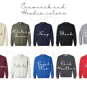 May include: A display of crewneck and hoodie colors, including sand, military green, navy, black, sport grey, maroon, white, royal blue, dark heather, and red. The text "Crewneck and Hoodie colors" is at the top.
