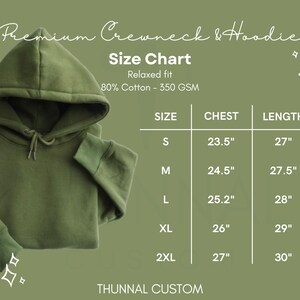May include: An olive green hoodie with a drawstring hood, displayed on a matching background. The image includes a size chart with chest and length measurements in inches for sizes S through 2XL. The text reads "Premium Crewneck & Hoodie".
