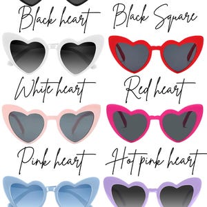 May include: A collection of sunglasses in various colors and styles. The image showcases heart-shaped sunglasses in black, white, red, pink, hot pink, blue, and lilac. There is also a pair of black square sunglasses. Each pair has dark lenses.