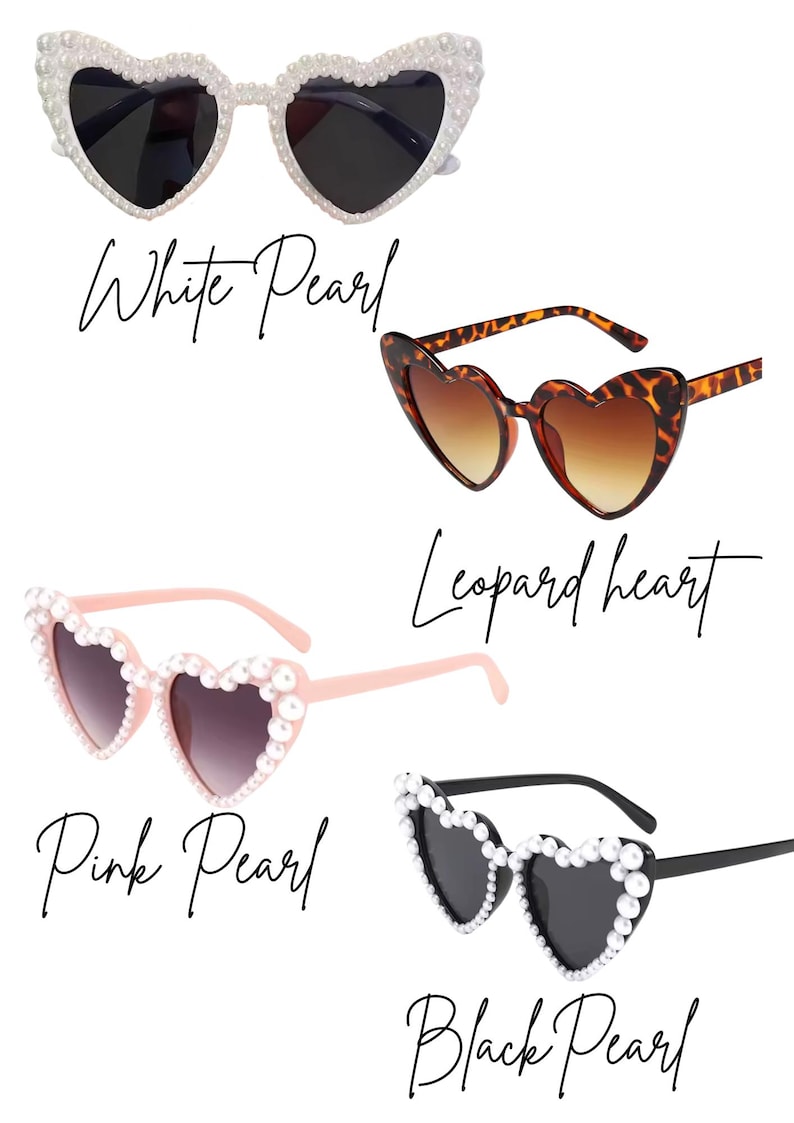 May include: Four pairs of heart-shaped sunglasses in various styles. The options include white pearl, leopard print, pink pearl, and black pearl designs. Each pair has dark lenses and is displayed against a white background.