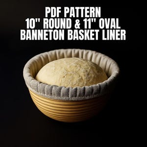 May include: A round banneton basket with a beige fabric liner containing a ball of raw bread dough. The text above reads: PDF PATTERN 10" ROUND & 11" OVAL BANNETON BASKET LINER. The basket has a ribbed exterior and is set against a black background.