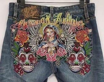 Christian Audigier Calaveras azules bordadas para hombre