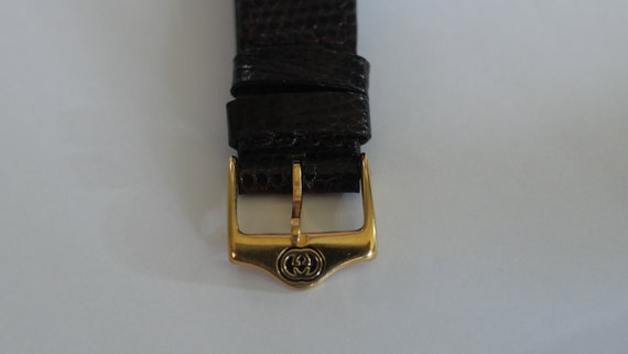 Authentic Gucci 3000M Gucci Stripe Dial Gold Plated Quartz  display picture 1