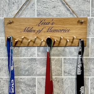 Personalised medal holder, every medal tells a story. Personalised with name, text can be personalised if required. Medal display.
